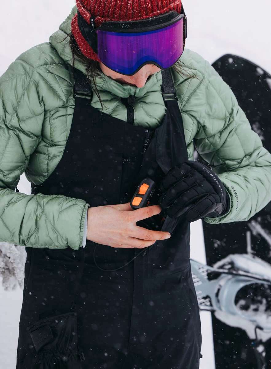 Burton Women's AK Gore-Tex Kimmy Bib Pant 2023 - Black bib pants with a white logo on the left leg and black straps over the shoulders.