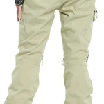 Burton Women's Gloria 2 Layer Stretch Pant 2024 - A pair of khaki-colored snow pants with zippered pockets and adjustable cuffs.