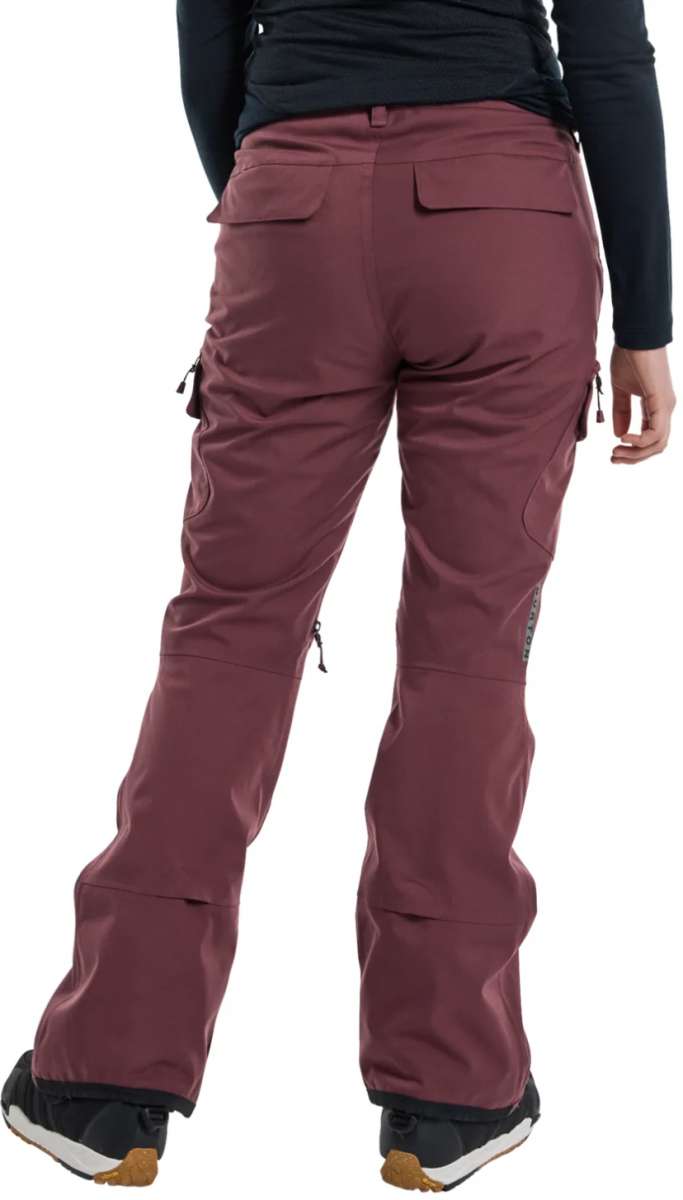 Burton Women's Gloria 2 Layer Stretch Pant 2024 - A pair of burgundy snow pants with a zippered pocket on the side and adjustable velcro straps at the waist.