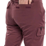 Burton Women's Gloria 2 Layer Stretch Pant 2024 - A pair of burgundy snow pants with a zippered pocket on the side and a small black zipper pull.