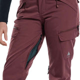 Burton Women's Gloria 2 Layer Stretch Pant 2024 - A pair of burgundy ski pants with a zippered pocket on the side and a small white logo near the bottom right leg.