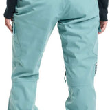 Burton Women's Gloria 2 Layer Stretch Pant 2024 - A pair of light blue snow pants with a black logo on the left thigh and a zippered pocket on the right hip.