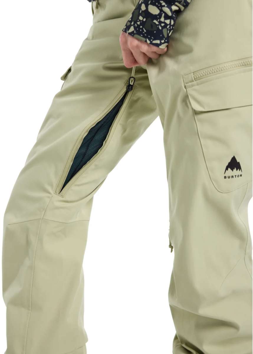 Burton Women's Gloria 2 Layer Stretch Pant 2024 - A pair of khaki-colored snow pants with a zippered pocket on the thigh and a black zipper running down the side.