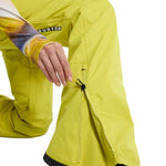 Burton Women's Marcy High Rise Stretch Pants 2024 - A pair of high-rise snow pants with a stretchy material and a zippered pocket on the side.