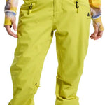 Burton Women's Marcy High Rise Stretch Pants 2024 - A pair of high-rise snow pants in a light green color with black accents and zippers on the side pockets.