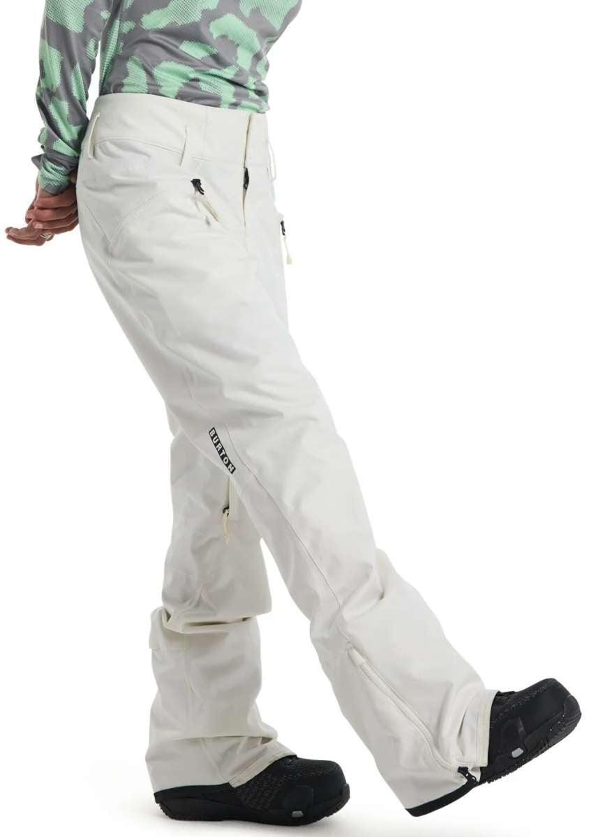 Burton Women's Marcy High Rise Stretch Pants 2024 - A pair of white snow pants with a high rise and stretch material, featuring a small black logo on the left leg.