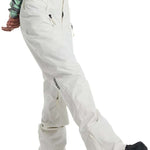 Burton Women's Marcy High Rise Stretch Pants 2024 - A pair of white snow pants with a high rise and stretch material, featuring a small black logo on the left leg.