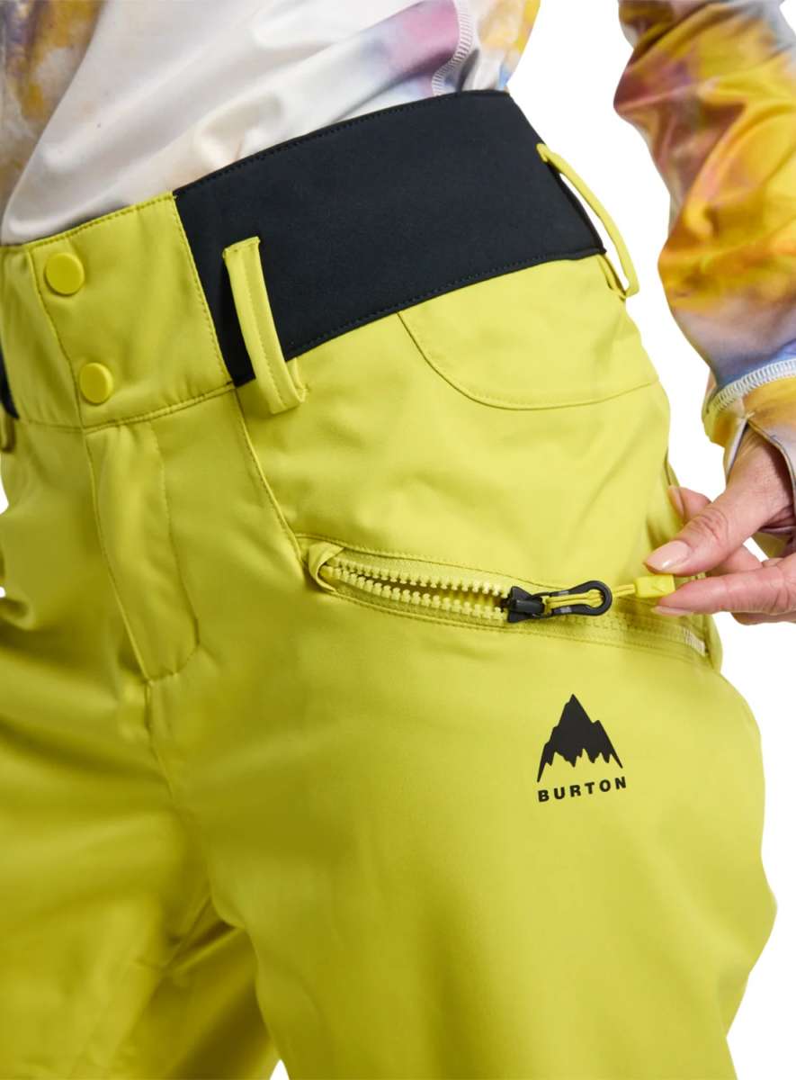 Burton Women's Marcy High Rise Stretch Pants 2024 - A pair of high-rise snow pants with a black waistband and belt loops, featuring a zippered pocket on the back.
