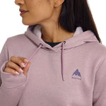 Burton Women's Oak Pullover Hoodie - A dusty rose-colored hoodie with a small, dark gray logo on the left chest featuring a mountain peak and the word "BURTON" in lowercase letters below it.