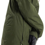 Burton Women's Pillowline GORE-TEX Insulated Jacket 2024 - A dark green jacket with a hood, featuring two zippered pockets on the front and a zipper down the middle.