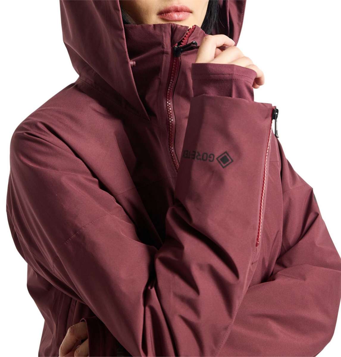 Burton Women's Pillowline GORE-TEX Insulated Jacket 2024 - A burgundy jacket with a high collar and zippered pockets, featuring a black zipper pull on one pocket.