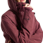 Burton Women's Pillowline GORE-TEX Insulated Jacket 2024 - A burgundy jacket with a high collar and zippered pockets, featuring a black zipper pull on one pocket.