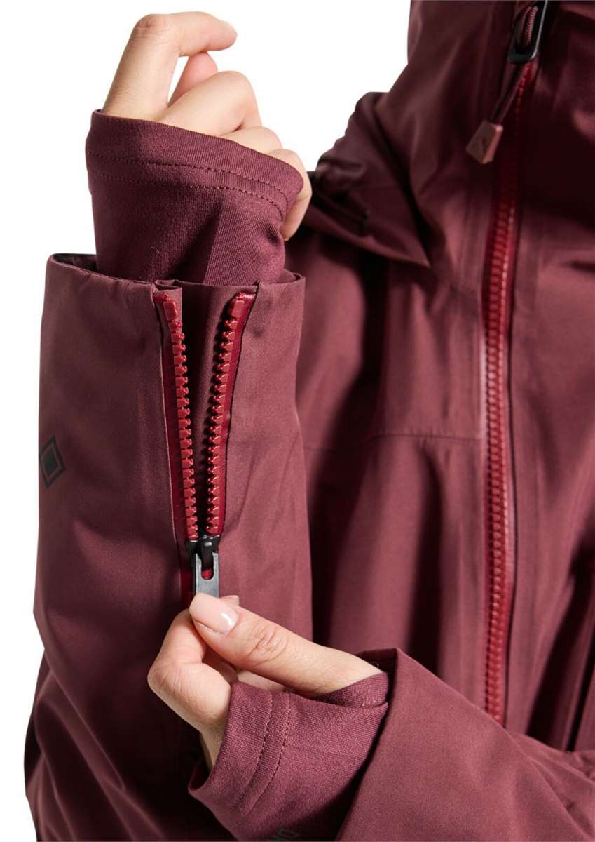 Burton Women's Pillowline GORE-TEX Insulated Jacket 2024 - A woman's jacket with a burgundy color and black zipper, featuring a diamond-shaped logo on the left sleeve.