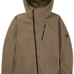 Burton Women's Pyne 2L Shell Jacket 2024 - A tan-colored jacket with a hood, featuring two zippered pockets on the front and a small logo on the left sleeve.