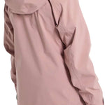 Burton Women's Pyne 2L Shell Jacket 2024 - A dusty rose-colored jacket with a hood, featuring a zipper and two zippered pockets on the front.