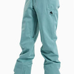 Burton Ladies Society 2L Insulated Pant 2024 - A pair of light blue snow pants with a black logo on the left thigh and two zippered pockets on the back.