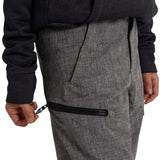 Burton Youth Exile 2L Insulated Cargo Pant 2024 - A pair of gray cargo pants with a zippered pocket on the thigh and a black zipper pull.