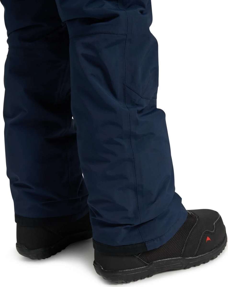 Burton Youth Exile 2L Insulated Cargo Pant 2024 - Dark blue snow pants with cargo pockets on each thigh and a zippered pocket at the back.