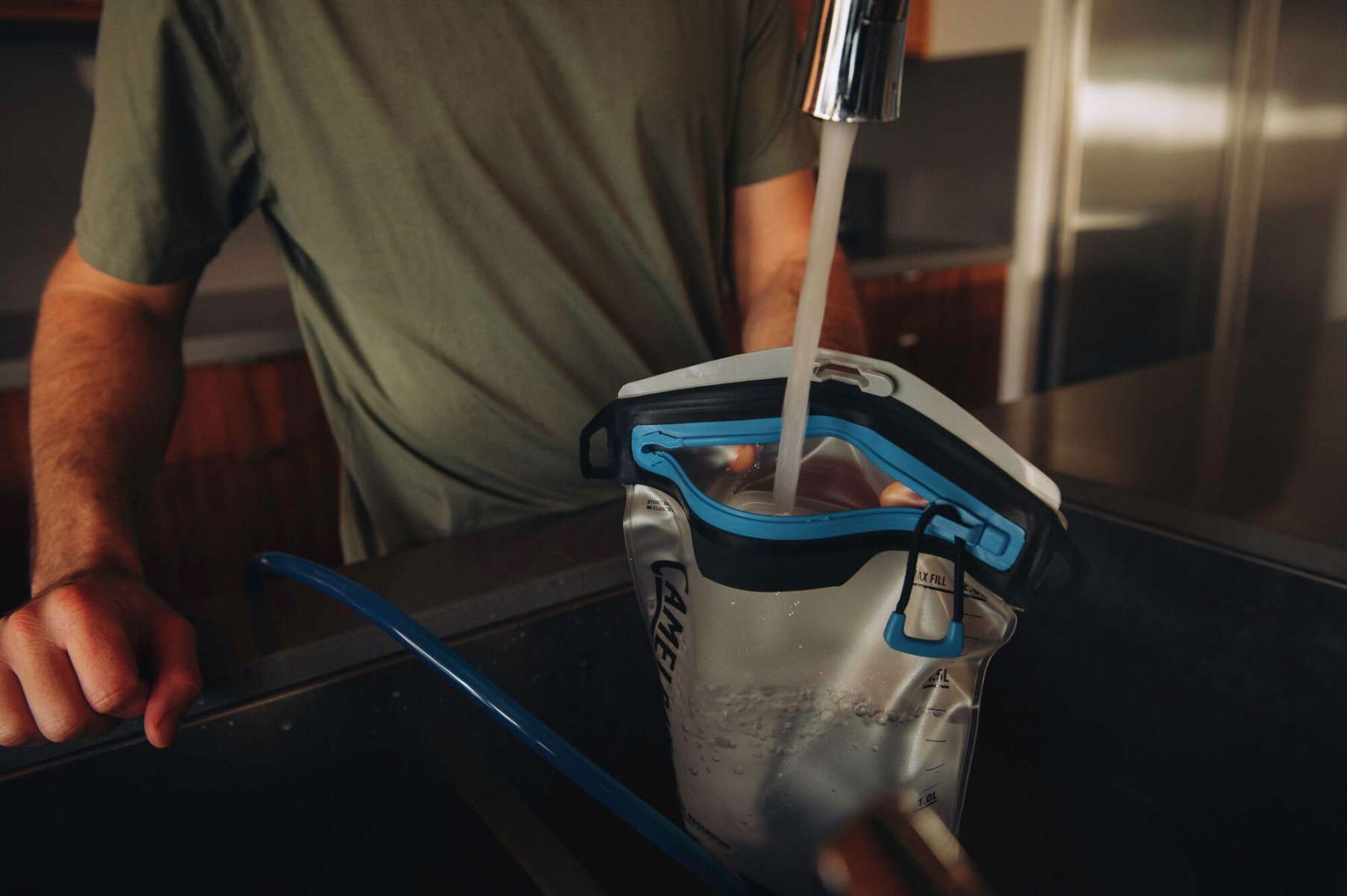 Camelbak Fusion 2L 70oz Reservoir - The reservoir is clear with a blue and black top.