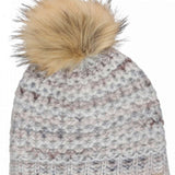 Chaos Ladies Laila Pom Beanie 2024 - A light-colored beanie with a large, fluffy tan pom-pom on top.