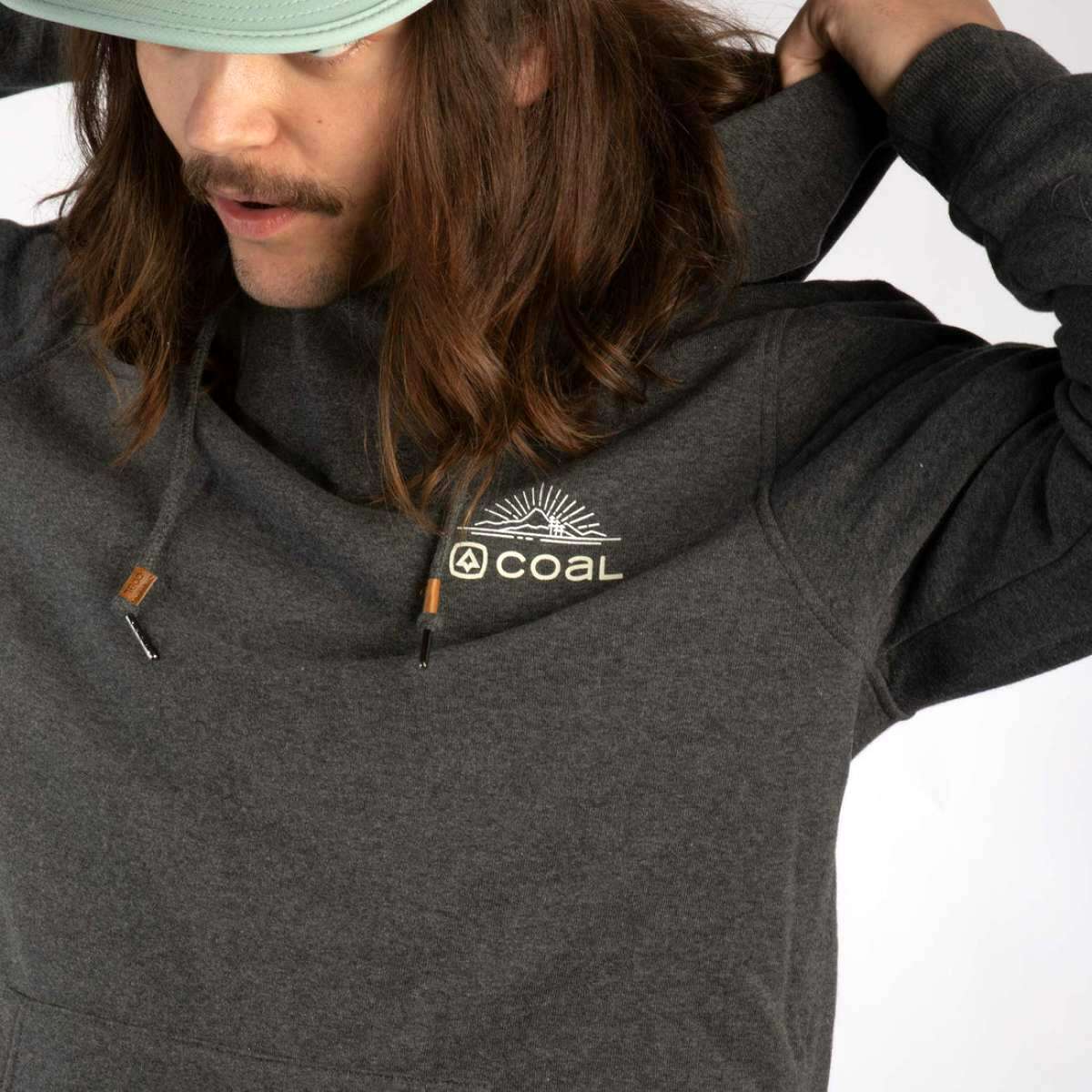 Coal Cultus Hoodie 2023 - A dark gray hoodie with a white logo on the left chest featuring a mountain and sun design.