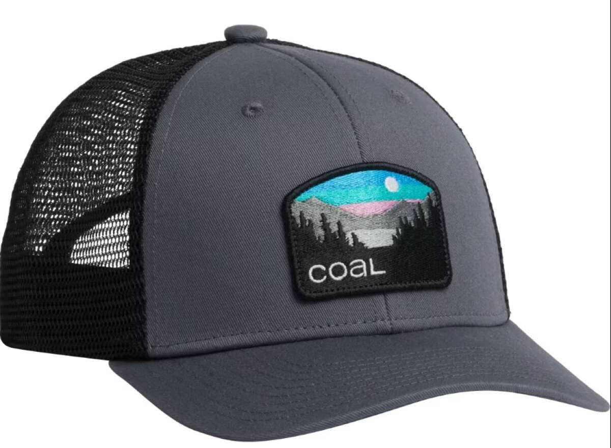 Coal Hauler Low One Cap 2024 - A dark gray cap with a black mesh back and a rectangular patch on the front featuring a mountain range under a blue sky, with trees in the foreground.