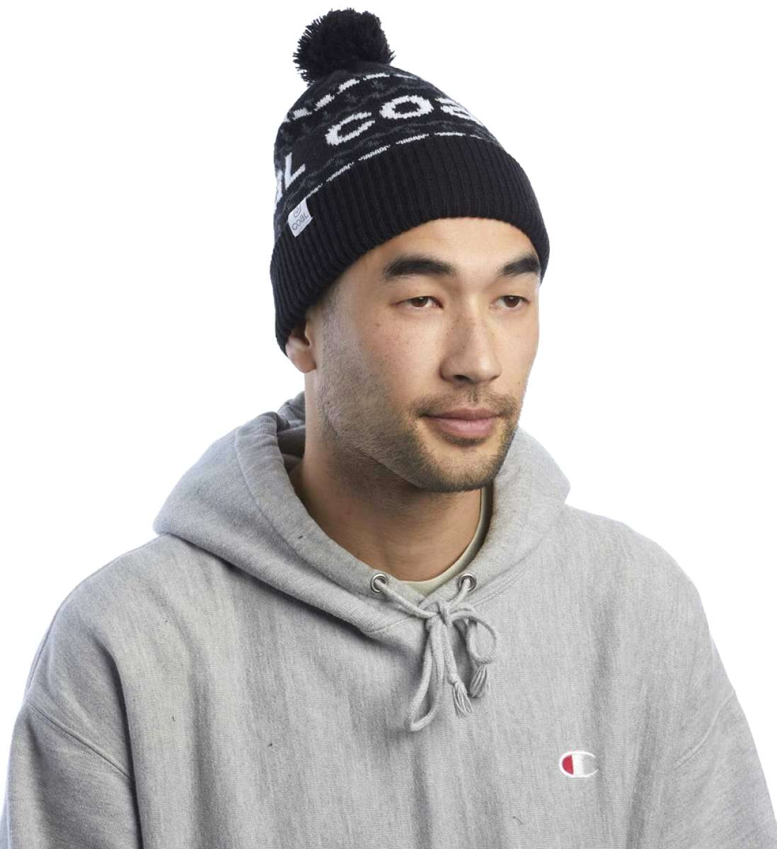 Coal Kelso Tall Pom Beanie - Black beanie with white lettering and a black pom-pom on top.