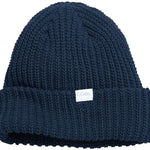 Coal Ladies Edith Mid Beanie 2023 - A navy blue beanie with a white label featuring the word "COAL" in gray letters.