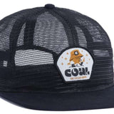 Coal Ripley Vintage Mesh Cap 2023 - A black mesh cap with a white patch on the front featuring an orange cartoon character wearing a bucket hat and glasses, surrounded by small gold stars.