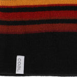 Coal Speed Demon Tall Beanie 2023 - A black beanie with a red and yellow stripe pattern on top.