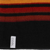 Coal Speed Demon Tall Beanie 2023 - A black beanie with a red and yellow stripe pattern on top.