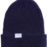 Coal Stanley Mid Length Beanie 2023 - A navy blue beanie with a white rectangular label on the front that says "COAL" in gray letters.