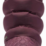 Columbia Ladies Minx Slip IV Boot 2022-2023 - A pair of dark brown boots with a quilted pattern on the upper portion and a thick, textured sole.