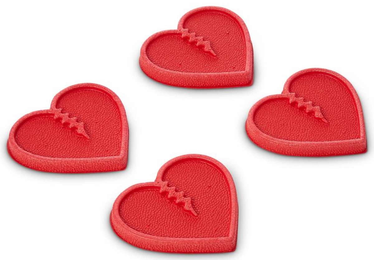 Crab Grab Mini Hearts Stomp Pad 2024 - Red heart-shaped pad with a textured surface and a small, raised logo in the center.