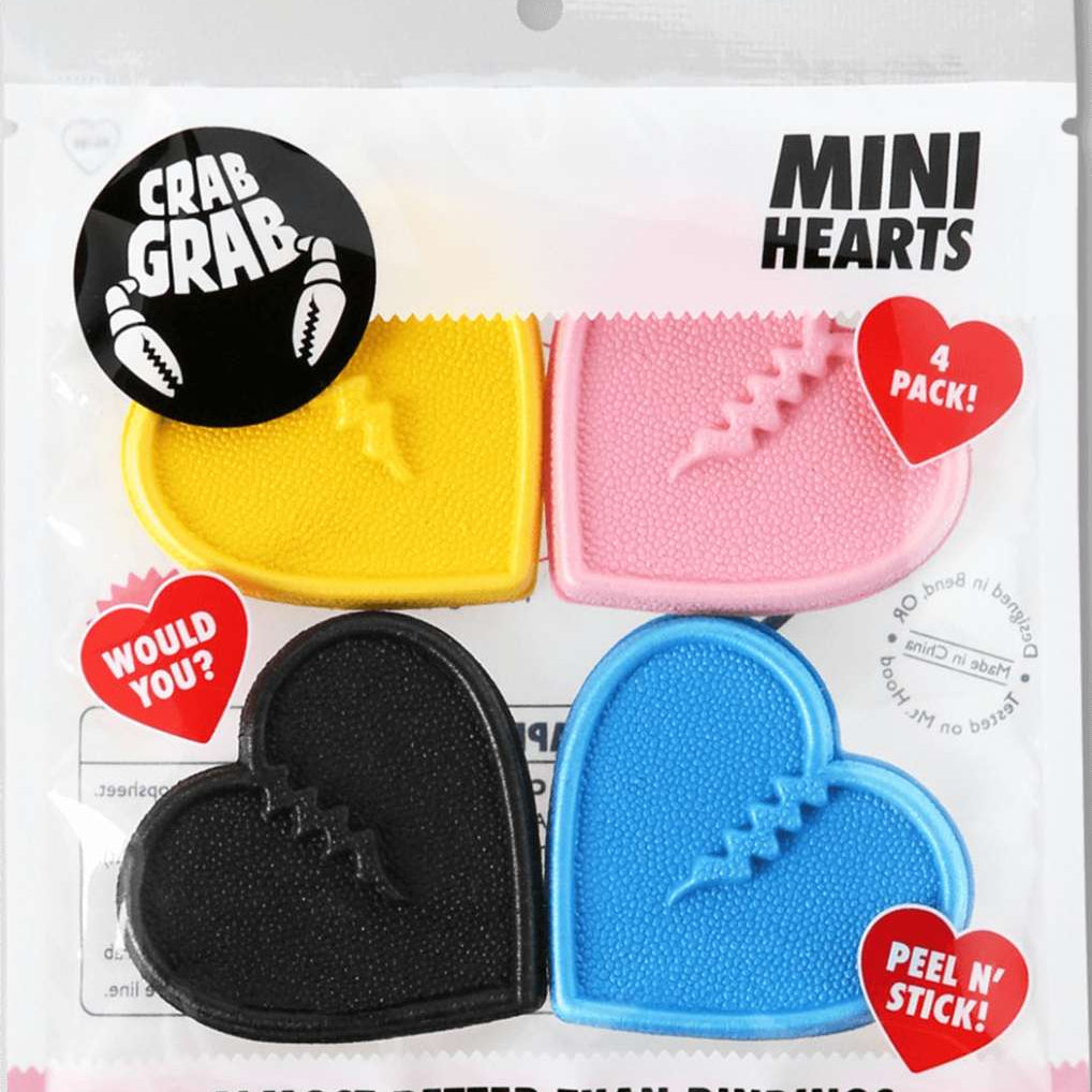Crab Grab Mini Hearts Stomp Pad 4 Pack 2022-2023 - Four heart-shaped pads in pink, blue, yellow and black.