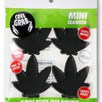 Crab Grab Mini Seaweed Stomp Pad 2024 - Black seaweed-shaped pad with white lettering on a black background.