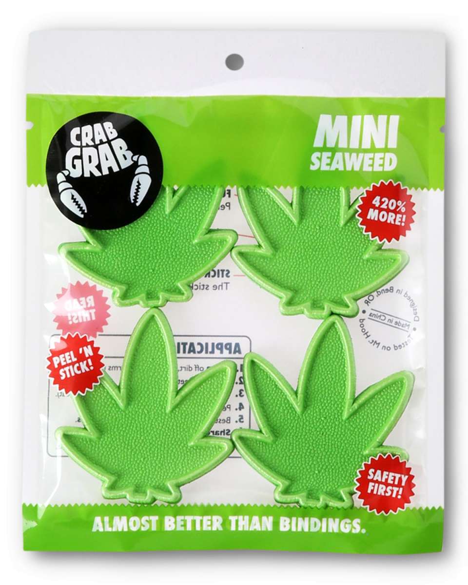 Crab Grab Mini Seaweed Stomp Pad 2024 - Green seaweed-shaped pad with a textured surface and a small, circular logo on top.