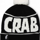 Crab Grab Pom Beanie 2022-2023 - A black beanie with a white pom-pom on top and "CRAB GRAB" embroidered in white across the front.