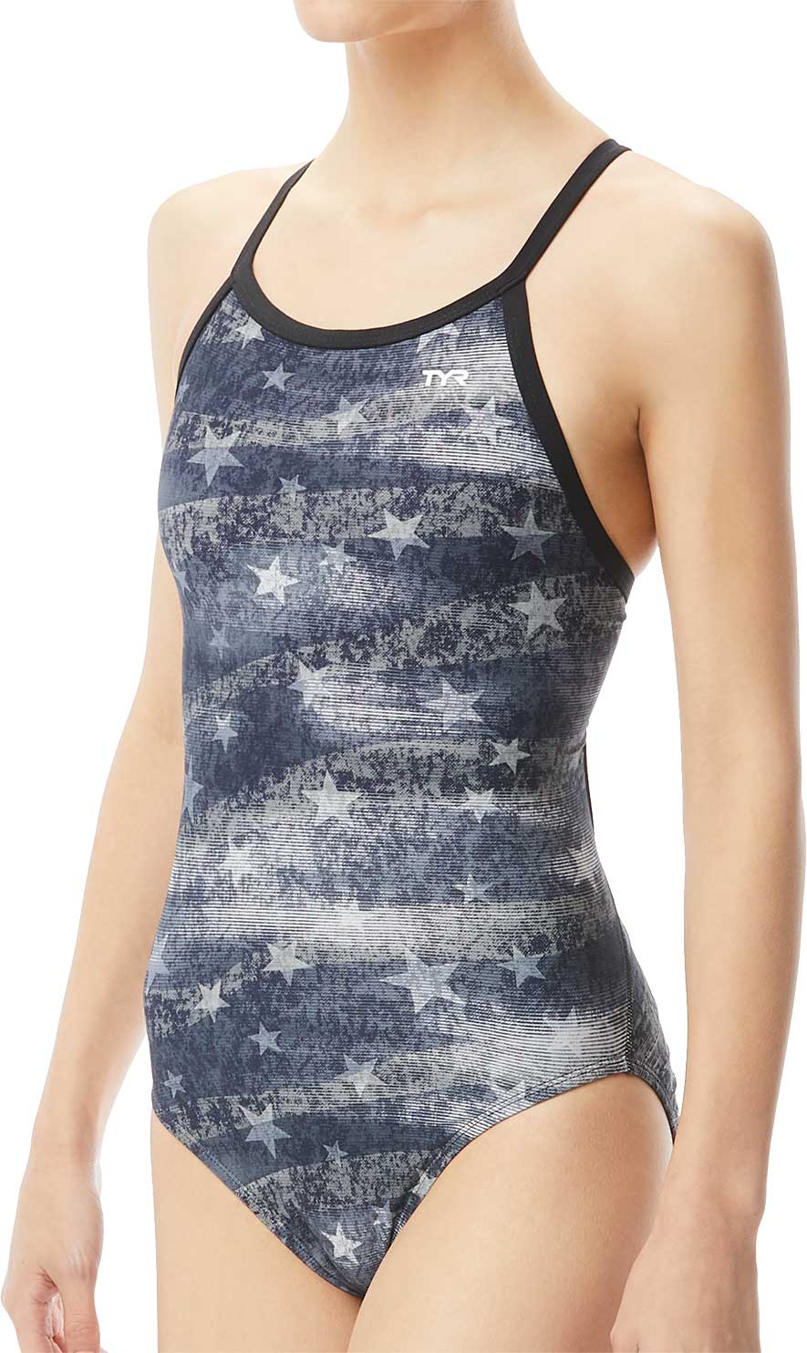 TYR Ladies' American Dream Diamondfit Swimsuit - A navy blue swimsuit with a pattern of faded white stars and stripes, featuring thin straps and a TYR logo on the upper left side.