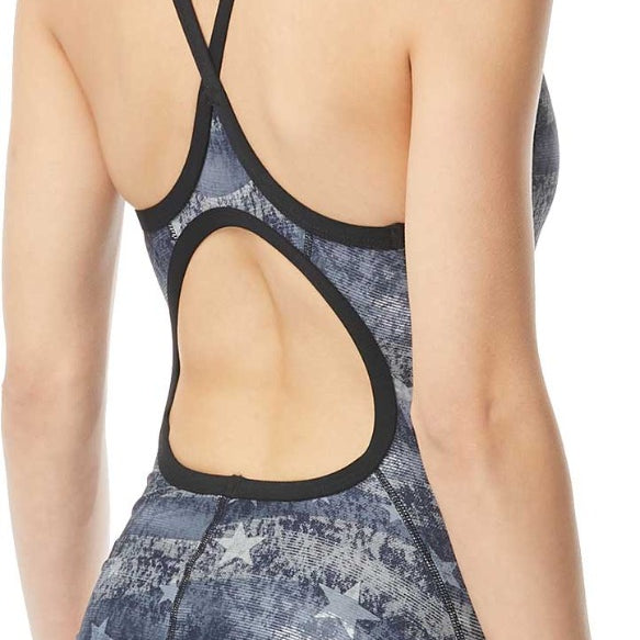 TYR Ladies' American Dream Diamondfit Swimsuit - A navy blue swimsuit with a diamond pattern and white stars, worn by a model from behind.