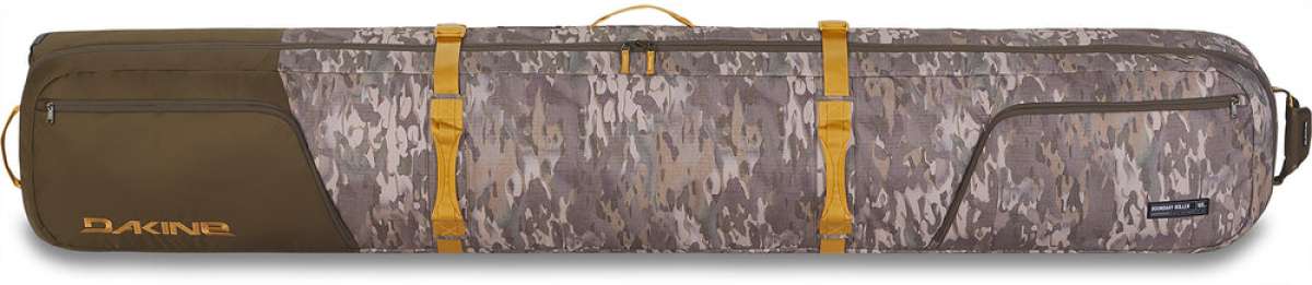 Dakine Boundary Ski Roller Bag 2024 - A brown ski roller bag with a zippered top and two side pockets, featuring a handle on one end.