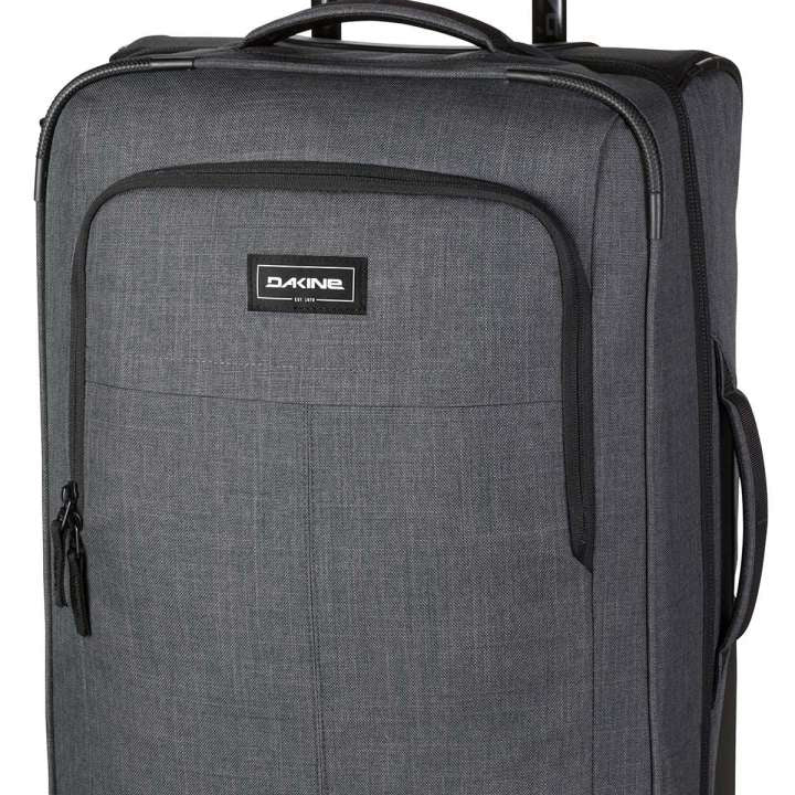 Dakine Carry-On Roller 42L 2022-2023 - A gray roller suitcase with a handle and wheels, featuring a zippered front pocket and a small black Dakine logo on the top.