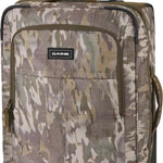 Dakine Carry-On Roller 42L Bag - A large, rectangular bag with a handle and wheels at the bottom, featuring a camouflage pattern in shades of brown and green.