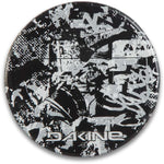 Dakine Circle Mat Stomp Pad 2024 - A black mat with a white abstract design and "DAKINE" logo in white at the bottom.