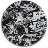 Dakine Circle Mat Stomp Pad 2024 - A black mat with a white abstract design and "DAKINE" logo in white at the bottom.