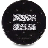 Dakine Circle Mat Stomp Pad 2024 - A black circular mat with a white topographic pattern and two clear suction cups in each corner.