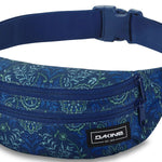 Dakine Classic Hip Pack 2023 - A blue hip pack with a zippered front pocket and adjustable strap, featuring a subtle floral pattern in light green and white on a dark blue background.