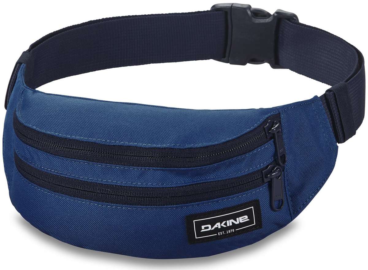 Dakine Classic Hip Pack 2023 - A blue hip pack with two zippered pockets and a black zipper pull on the top pocket.