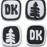 Dakine Dots Stomp Pad 2024 - A black stomp pad with a white grid pattern and rounded edges.