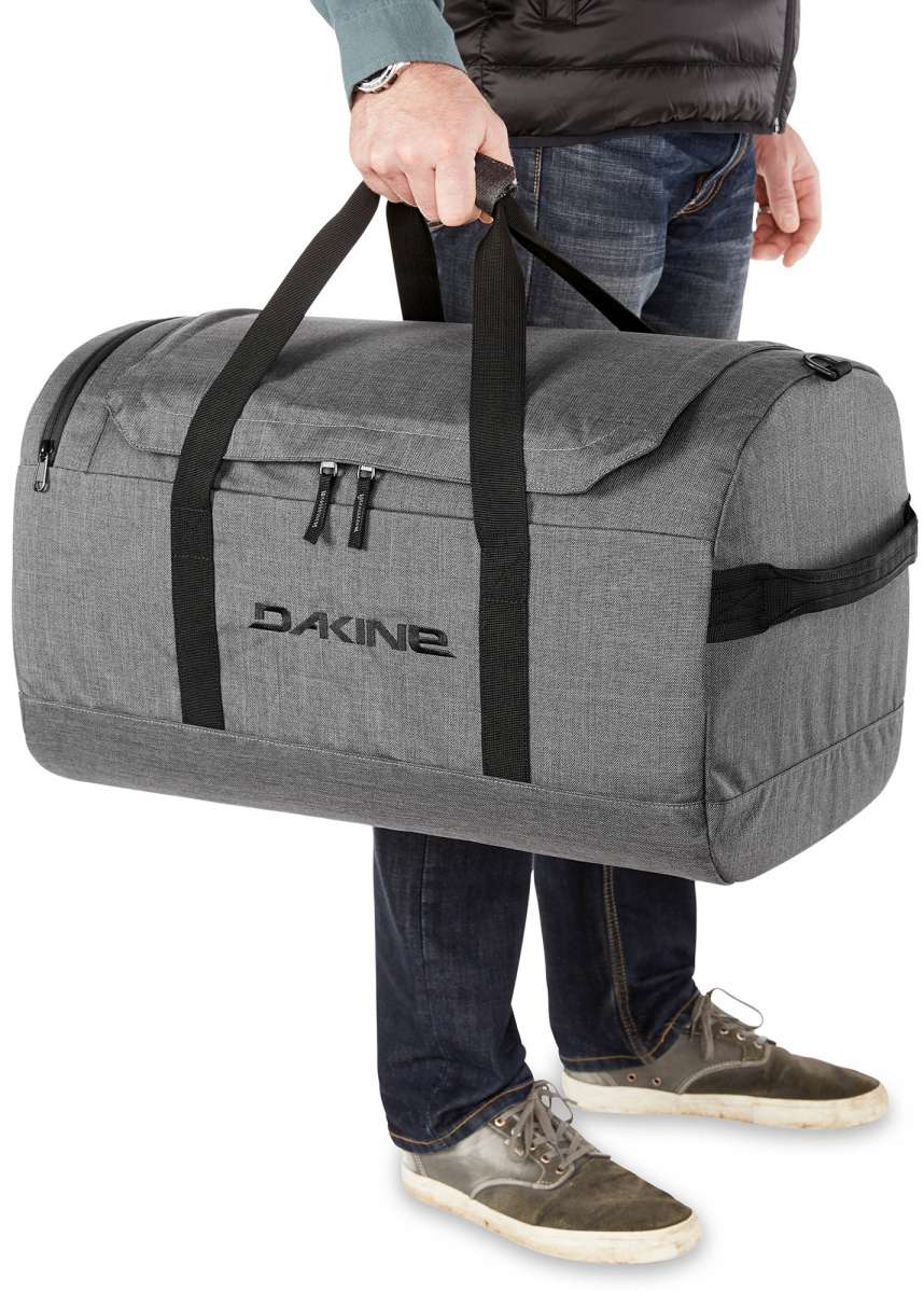 Dakine EQ Duffle 70L Bag 2024 - A large grey duffel bag with black straps and zippers.